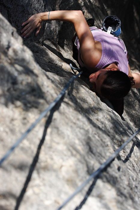 Beth Marek top rope climbing Hollywood (5.7), taken from the anchors of the route.  It was Beth's third time outside, and another long day of rock climbing at Seismic Wall on Austin's Barton Creek Greenbelt, Monday, May 25, 2009.

Filename: SRM_20090525_10412284.JPG
Aperture: f/5.6
Shutter Speed: 1/2000
Body: Canon EOS-1D Mark II
Lens: Canon EF 80-200mm f/2.8 L