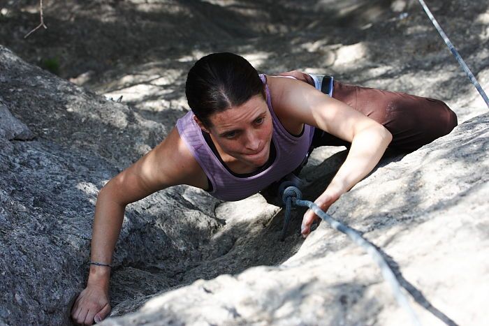 Beth Marek top rope climbing Hollywood (5.7), taken from the anchors of the route.  It was Beth's third time outside, and another long day of rock climbing at Seismic Wall on Austin's Barton Creek Greenbelt, Monday, May 25, 2009.

Filename: SRM_20090525_10413289.JPG
Aperture: f/5.6
Shutter Speed: 1/640
Body: Canon EOS-1D Mark II
Lens: Canon EF 80-200mm f/2.8 L