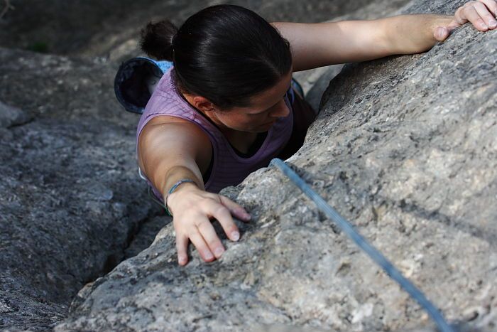 Beth Marek top rope climbing Hollywood (5.7), taken from the anchors of the route.  It was Beth's third time outside, and another long day of rock climbing at Seismic Wall on Austin's Barton Creek Greenbelt, Monday, May 25, 2009.

Filename: SRM_20090525_10423009.JPG
Aperture: f/5.6
Shutter Speed: 1/640
Body: Canon EOS-1D Mark II
Lens: Canon EF 80-200mm f/2.8 L