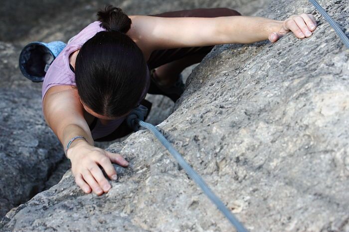 Beth Marek top rope climbing Hollywood (5.7), taken from the anchors of the route.  It was Beth's third time outside, and another long day of rock climbing at Seismic Wall on Austin's Barton Creek Greenbelt, Monday, May 25, 2009.

Filename: SRM_20090525_10423412.JPG
Aperture: f/5.6
Shutter Speed: 1/400
Body: Canon EOS-1D Mark II
Lens: Canon EF 80-200mm f/2.8 L