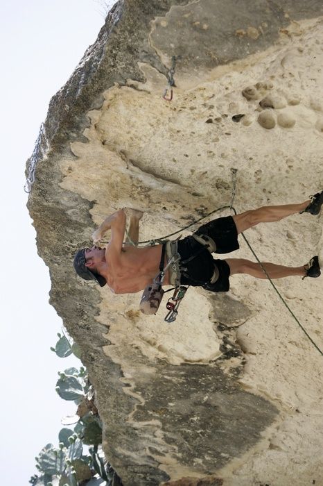 Tyler climbing Lonsome Dove (5.12), the roof above Diving for Rocks.  It was another long day of rock climbing at Seismic Wall on Austin's Barton Creek Greenbelt, Sunday, June 7, 2009.

Filename: SRM_20090607_13443295.jpg
Aperture: f/4.0
Shutter Speed: 1/500
Body: Canon EOS-1D Mark II
Lens: Canon EF 80-200mm f/2.8 L