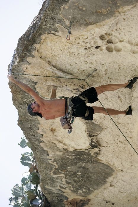 Tyler climbing Lonsome Dove (5.12), the roof above Diving for Rocks.  It was another long day of rock climbing at Seismic Wall on Austin's Barton Creek Greenbelt, Sunday, June 7, 2009.

Filename: SRM_20090607_13443497.jpg
Aperture: f/4.0
Shutter Speed: 1/500
Body: Canon EOS-1D Mark II
Lens: Canon EF 80-200mm f/2.8 L