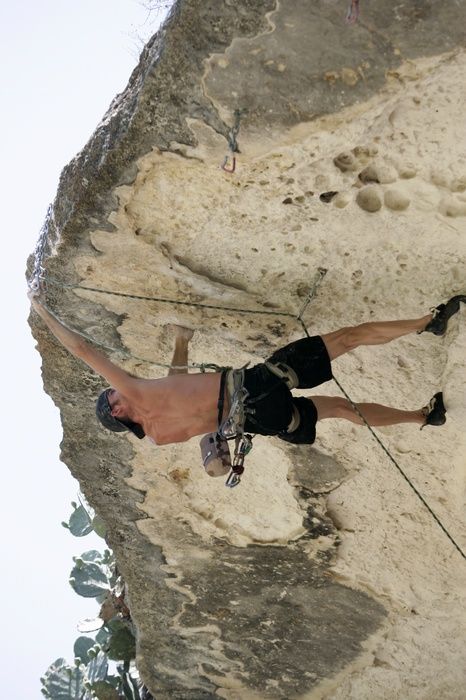 Tyler climbing Lonsome Dove (5.12), the roof above Diving for Rocks.  It was another long day of rock climbing at Seismic Wall on Austin's Barton Creek Greenbelt, Sunday, June 7, 2009.

Filename: SRM_20090607_13443598.jpg
Aperture: f/4.0
Shutter Speed: 1/500
Body: Canon EOS-1D Mark II
Lens: Canon EF 80-200mm f/2.8 L