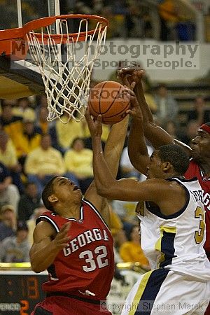 Zam Fredrick II takes a shot.  Men's Basketball Georgia Tech beat UGA 87-49.

Filename: crw_6042_std.jpg
Aperture: f/2.8
Shutter Speed: 1/640
Body: Canon EOS DIGITAL REBEL
Lens: Canon EF 80-200mm f/2.8 L