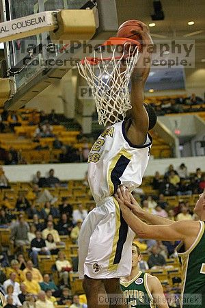 Isma'il Muhammad dunks on LeMoyne.                                                                                                                                                                                                                             

Filename: img_4079_std.jpg
Aperture: f/2.8
Shutter Speed: 1/500
Body: Canon EOS DIGITAL REBEL
Lens: Canon EF 80-200mm f/2.8 L