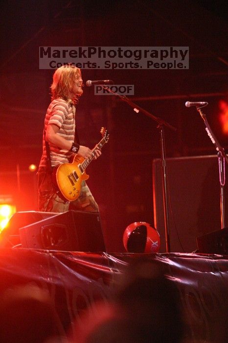 Puddle of Mudd performs on the 99X stage on the first day of Music Midtown, 2004.

Filename: IMG_6121.jpg
Aperture: f/2.8
Shutter Speed: 1/200
Body: Canon EOS DIGITAL REBEL
Lens: Canon EF 80-200mm f/2.8 L