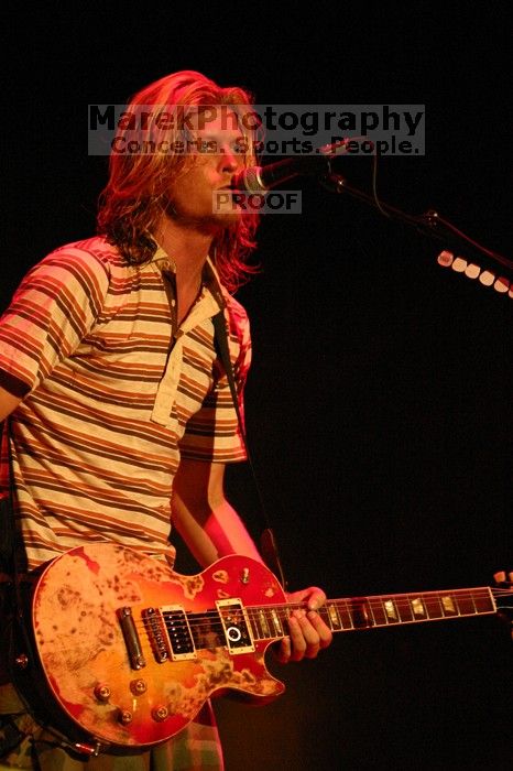 Puddle of Mudd performs on the first day of Music Midtown, 2004.

Filename: IMG_6064.jpg
Aperture: f/2.8
Shutter Speed: 1/160
Body: Canon EOS DIGITAL REBEL
Lens: Canon EF 80-200mm f/2.8 L