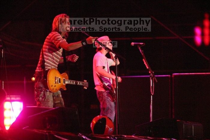 Puddle of Mudd performs on the 99X stage on the first day of Music Midtown, 2004.

Filename: IMG_6117.jpg
Aperture: f/2.8
Shutter Speed: 1/200
Body: Canon EOS DIGITAL REBEL
Lens: Canon EF 80-200mm f/2.8 L