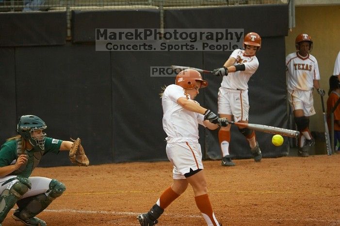 #4, MicKayla Padilla, bats against the Mean Green.  The Lady Longhorns beat the University of North Texas 5-0 in the first game of the double header Wednesday night.

Filename: SRM_20060308_210206_7.jpg
Aperture: f/2.8
Shutter Speed: 1/1600
Body: Canon EOS 20D
Lens: Canon EF 80-200mm f/2.8 L