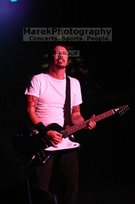 The Foo Fighters perform on the 99X stage on the second day of Music Midtown, 2004.

Filename: IMG_6814.jpg
Aperture: f/2.8
Shutter Speed: 1/250
Body: Canon EOS DIGITAL REBEL
Lens: Canon EF 80-200mm f/2.8 L