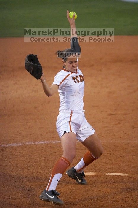 Cat Osterman pitching to the Mean Green.  The Lady Longhorns beat the University of North Texas 5-0 in the first game of the double header Wednesday night.

Filename: SRM_20060308_212130_4.jpg
Aperture: f/2.8
Shutter Speed: 1/1000
Body: Canon EOS 20D
Lens: Canon EF 80-200mm f/2.8 L