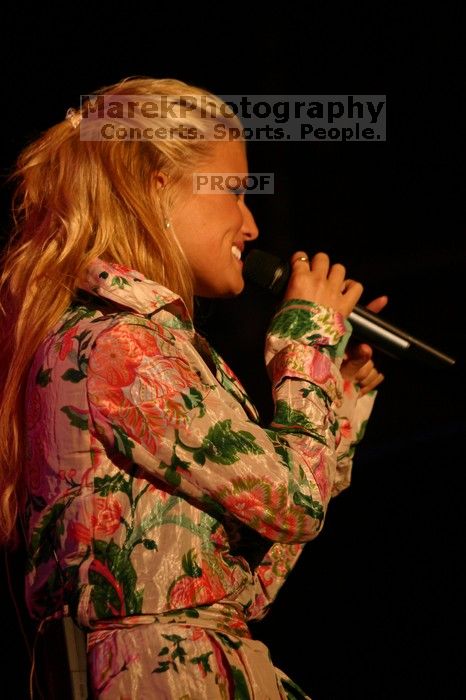 Jessica Simpson performs on the third day of Music Midtown, 2004.

Filename: IMG_7299.jpg
Aperture: f/2.8
Shutter Speed: 1/250
Body: Canon EOS DIGITAL REBEL
Lens: Canon EF 80-200mm f/2.8 L