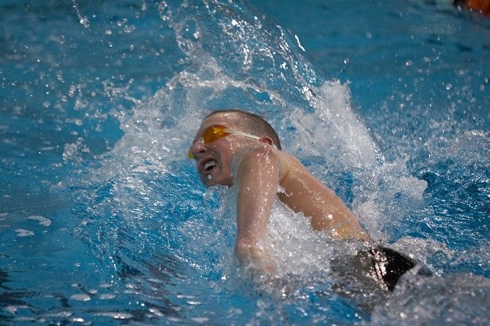 Scott Drews of the University of Texas Men's Varsity Swim Team placed 5th in the 1st heat of the 1650 Freestyle Finals with a time of 15:38.65 at the Speedo American Short Course Championships.

Filename: SRM_20060304_185354_4.jpg
Aperture: f/2.8
Shutter Speed: 1/1000
Body: Canon EOS 20D
Lens: Canon EF 80-200mm f/2.8 L