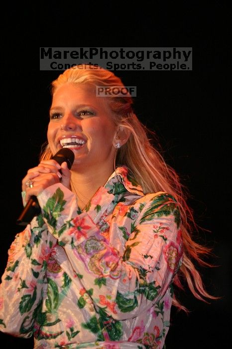 Jessica Simpson performs on the third day of Music Midtown, 2004.

Filename: IMG_7267.jpg
Aperture: f/2.8
Shutter Speed: 1/250
Body: Canon EOS DIGITAL REBEL
Lens: Canon EF 80-200mm f/2.8 L