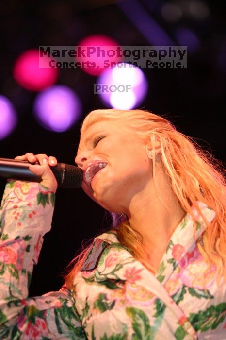 Jessica Simpson performs on the third day of Music Midtown, 2004.

Filename: IMG_7325.jpg
Aperture: f/2.8
Shutter Speed: 1/250
Body: Canon EOS DIGITAL REBEL
Lens: Canon EF 80-200mm f/2.8 L