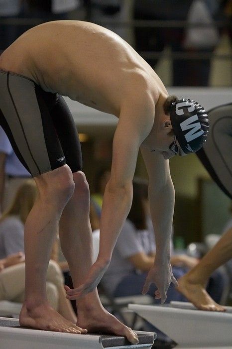 Michael Phelps of the University of Michigan Swim Team placed 1st in the last heat of the 200 IM Finals with a record time of 1:41.30, beating the old record of 1:41.71 at the Speedo American Short Course Championships.

Filename: SRM_20060304_192154_2.jpg
Aperture: f/3.5
Shutter Speed: 1/800
Body: Canon EOS 20D
Lens: Canon EF 80-200mm f/2.8 L