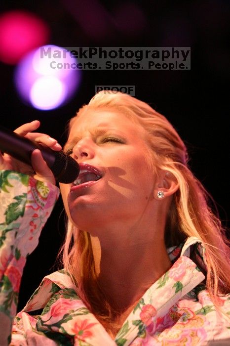 Jessica Simpson performs on the third day of Music Midtown, 2004.

Filename: IMG_7304.jpg
Aperture: f/2.8
Shutter Speed: 1/250
Body: Canon EOS DIGITAL REBEL
Lens: Canon EF 80-200mm f/2.8 L