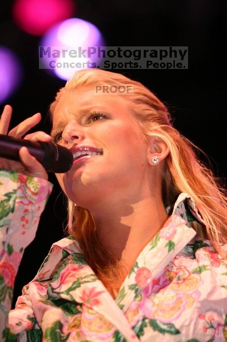 Jessica Simpson performs on the third day of Music Midtown, 2004.

Filename: IMG_7303.jpg
Aperture: f/2.8
Shutter Speed: 1/250
Body: Canon EOS DIGITAL REBEL
Lens: Canon EF 80-200mm f/2.8 L