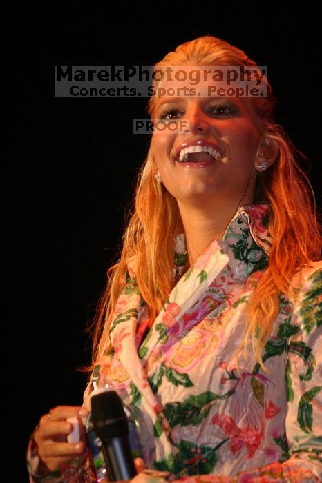 Jessica Simpson performs on the third day of Music Midtown, 2004.

Filename: IMG_7271.jpg
Aperture: f/2.8
Shutter Speed: 1/250
Body: Canon EOS DIGITAL REBEL
Lens: Canon EF 80-200mm f/2.8 L