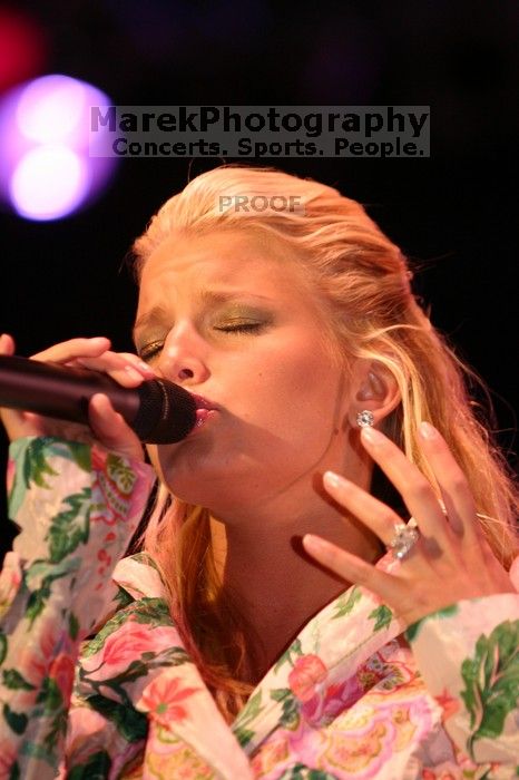 Jessica Simpson performs on the third day of Music Midtown, 2004.

Filename: IMG_7305.jpg
Aperture: f/2.8
Shutter Speed: 1/250
Body: Canon EOS DIGITAL REBEL
Lens: Canon EF 80-200mm f/2.8 L