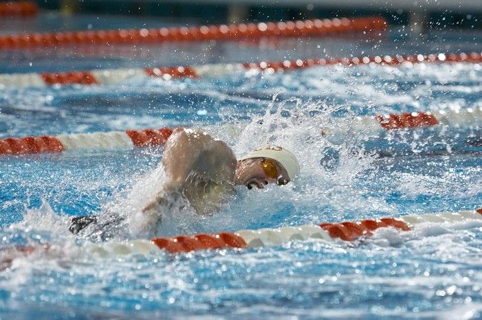 Matthew Lowe of the University of Texas Men's Varsity Swim Team placed 6th in the last heat of the 200 IM Finals with a time of 1:50.02 at the Speedo American Short Course Championships.

Filename: SRM_20060304_192340_2.jpg
Aperture: f/3.5
Shutter Speed: 1/800
Body: Canon EOS 20D
Lens: Canon EF 80-200mm f/2.8 L