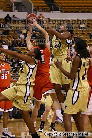 The Georgia Tech women's basketball team played Clemson.

Filename: img_0586_std.jpg
Aperture: f/2.8
Shutter Speed: 1/320
Body: Canon EOS DIGITAL REBEL
Lens: Canon EF 80-200mm f/2.8 L