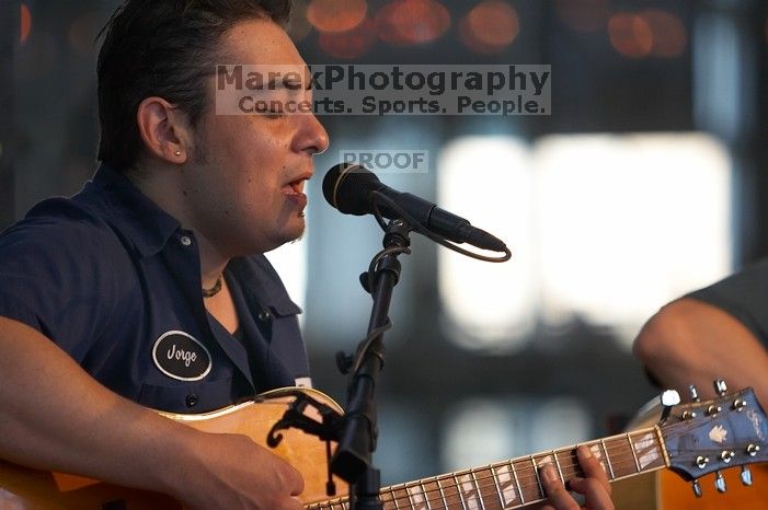 The Gene Pool, performing at the Austin airport.  Geno Stroia II on vocals/guitar, Jorge Castillo on vocals/guitar, Travis Woodard on drums and Steven Ray Will on vocals/bass guitar.

Filename: SRM_20060518_155630_8.jpg
Aperture: f/2.8
Shutter Speed: 1/250
Body: Canon EOS 20D
Lens: Canon EF 80-200mm f/2.8 L