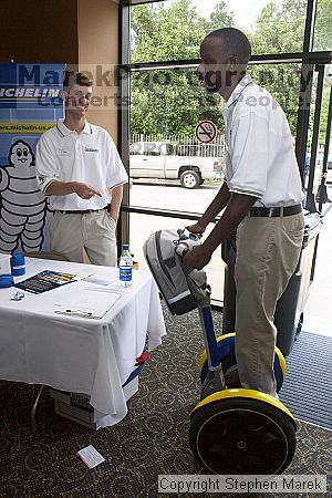 A Michelin recruiter plays with a Segway.

Filename: crw_0777_std.jpg
Aperture: f/7.1
Shutter Speed: 1/200
Body: Canon EOS DIGITAL REBEL
Lens: Canon EF-S 18-55mm f/3.5-5.6