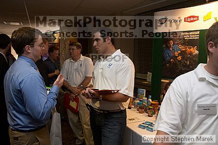 Josh Keller speaks with a recruiter at the career fair.

Filename: crw_0762_std.jpg
Aperture: f/5.0
Shutter Speed: 1/60
Body: Canon EOS DIGITAL REBEL
Lens: Canon EF-S 18-55mm f/3.5-5.6