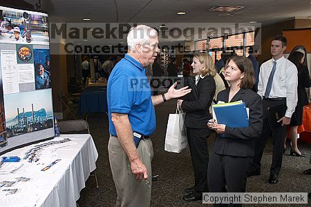 speaks with a recruiter at the career fair.

Filename: crw_0764_std.jpg
Aperture: f/5.0
Shutter Speed: 1/60
Body: Canon EOS DIGITAL REBEL
Lens: Canon EF-S 18-55mm f/3.5-5.6