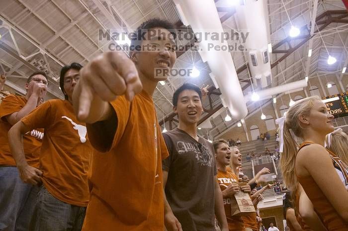 Justin Fang and Geoffrey 'Geo' Tu enjoying the volleyball game.  The University of Texas women's volleyball team defeated Oklahoma State University (OSU) 3-2 on Saturday, October 21, 2006.

Filename: SRM_20061021_2053342.jpg
Aperture: f/5.0
Shutter Speed: 1/125
Body: Canon EOS DIGITAL REBEL
Lens: Canon EF-S 18-55mm f/3.5-5.6