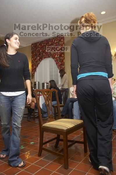 Christina Ramirez and Brittany Hibbs battle it out for first place in musical chairs at the Alpha Delta Pi Christmas party, Sunday, December 10, 2006.  Christina won.

Filename: SRM_20061210_1816529.jpg
Aperture: f/5.0
Shutter Speed: 1/100
Body: Canon EOS 20D
Lens: Canon EF-S 18-55mm f/3.5-5.6