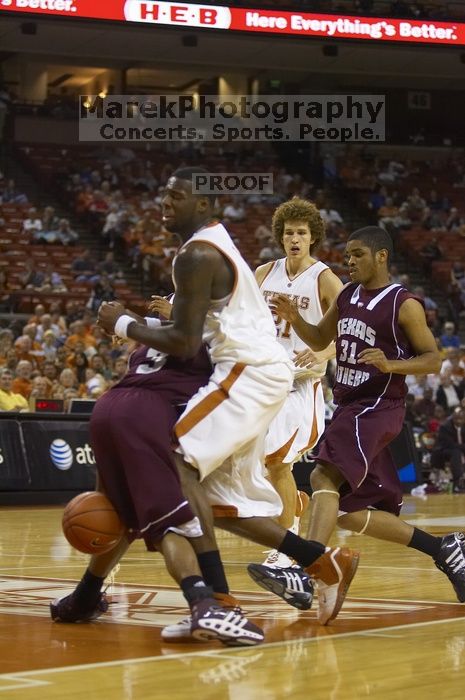 Forward Damion James, #5.  The longhorns defeated the Texas Southern University (TSU) Tigers 90-50 Tuesday night.

Filename: SRM_20061128_2023026.jpg
Aperture: f/2.8
Shutter Speed: 1/640
Body: Canon EOS-1D Mark II
Lens: Canon EF 80-200mm f/2.8 L