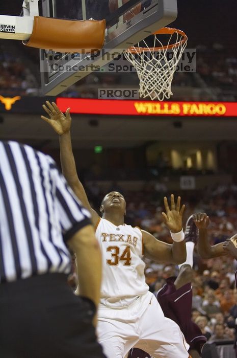 Center Dexter Pittman, #34.  The longhorns defeated the Texas Southern University (TSU) Tigers 90-50 Tuesday night.

Filename: SRM_20061128_2029545.jpg
Aperture: f/2.8
Shutter Speed: 1/640
Body: Canon EOS-1D Mark II
Lens: Canon EF 80-200mm f/2.8 L