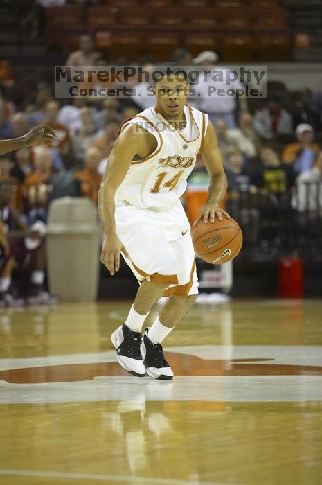 Guard D.J. Augustin, #14.  The longhorns defeated the Texas Southern University (TSU) Tigers 90-50 Tuesday night.

Filename: SRM_20061128_2048429.jpg
Aperture: f/2.8
Shutter Speed: 1/640
Body: Canon EOS-1D Mark II
Lens: Canon EF 80-200mm f/2.8 L