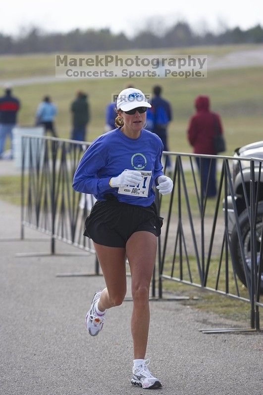 Kathy Cleary, 1:37:50, finishing the Decker Challenge 20K 2006 road race.

Filename: SRM_20061203_0941463.jpg
Aperture: f/4.0
Shutter Speed: 1/500
Body: Canon EOS-1D Mark II
Lens: Canon EF 80-200mm f/2.8 L