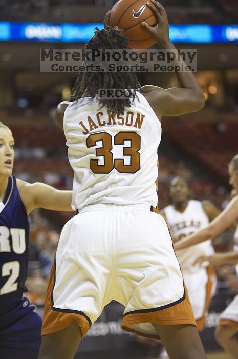 Forward Tiffany Jackson, #33.  The lady longhorns defeated the Oral Roberts University's (ORU) Golden Eagles 79-40 Saturday night.

Filename: SRM_20061125_1316127.jpg
Aperture: f/2.8
Shutter Speed: 1/400
Body: Canon EOS-1D Mark II
Lens: Canon EF 80-200mm f/2.8 L