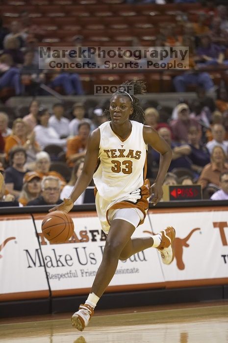 Forward Tiffany Jackson, #33.  The lady longhorns defeated the Oral Roberts University's (ORU) Golden Eagles 79-40 Saturday night.

Filename: SRM_20061125_1329004.jpg
Aperture: f/2.8
Shutter Speed: 1/400
Body: Canon EOS-1D Mark II
Lens: Canon EF 80-200mm f/2.8 L