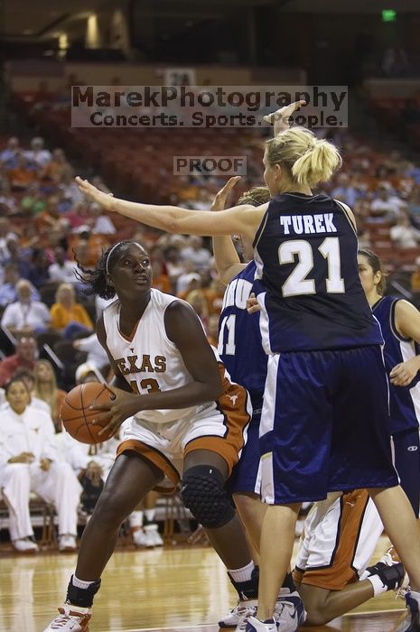 The lady longhorns defeated the Oral Roberts University's (ORU) Golden Eagles 79-40 Saturday night.

Filename: SRM_20061125_1358368.jpg
Aperture: f/2.8
Shutter Speed: 1/400
Body: Canon EOS-1D Mark II
Lens: Canon EF 80-200mm f/2.8 L