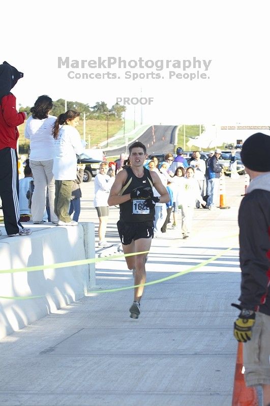 John Keane, bib #1622, placed first with a time of 54:07 at The Girl Scout Scenic 10 Miler road race, Sunday, October 22, 2006.

Filename: SRM_20061022_0848509.jpg
Aperture: f/5.0
Shutter Speed: 1/160
Body: Canon EOS 20D
Lens: Canon EF 80-200mm f/2.8 L