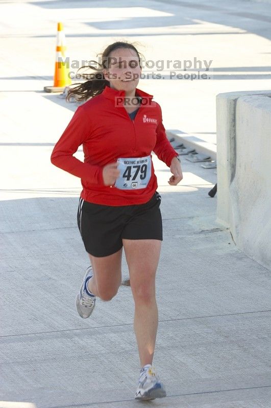 Beth Brewster running The Girl Scout Scenic 10 Miler road race, Sunday, October 22, 2006.

Filename: SRM_20061022_0914448.jpg
Aperture: f/5.6
Shutter Speed: 1/250
Body: Canon EOS 20D
Lens: Canon EF 80-200mm f/2.8 L