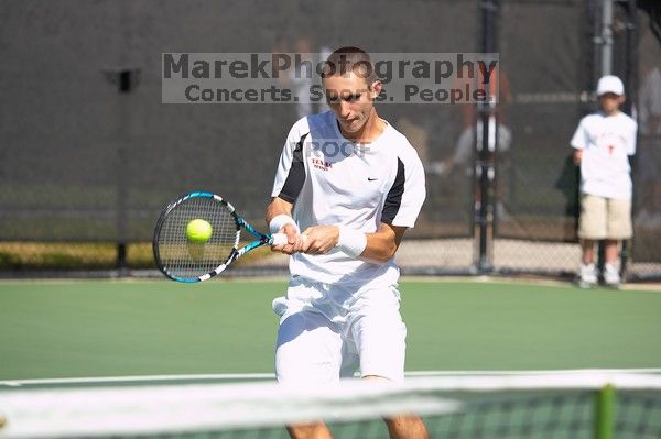 Texas' Dimitar Kutrovsky defeated Tech's Jose Muguruza 6-2 and 6-3.  The University of Texas (UT) men's tennis team defeated Georgia Tech (GT) Saturday, February 24, 2007..

Filename: SRM_20070224_1411567.jpg
Aperture: f/4.0
Shutter Speed: 1/2000
Body: Canon EOS-1D Mark II
Lens: Canon EF 80-200mm f/2.8 L