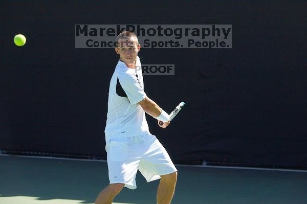 Texas' Dimitar Kutrovsky defeated Tech's Jose Muguruza 6-2 and 6-3.  The University of Texas (UT) men's tennis team defeated Georgia Tech (GT) Saturday, February 24, 2007..

Filename: SRM_20070224_1419500.jpg
Aperture: f/4.0
Shutter Speed: 1/3200
Body: Canon EOS-1D Mark II
Lens: Canon EF 80-200mm f/2.8 L