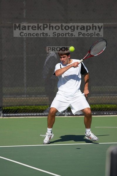 Milan Mihailovic (UT) defeated Jordan DeLass (GT) 6-4, 6-4.  The University of Texas (UT) men's tennis team defeated Georgia Tech (GT) Saturday, February 24, 2007..

Filename: SRM_20070224_1440106.jpg
Aperture: f/4.0
Shutter Speed: 1/8000
Body: Canon EOS-1D Mark II
Lens: Canon EF 80-200mm f/2.8 L