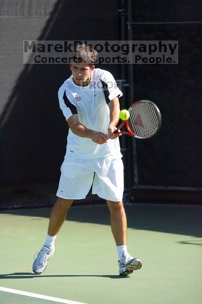 Milan Mihailovic (UT) defeated Jordan DeLass (GT) 6-4, 6-4.  The University of Texas (UT) men's tennis team defeated Georgia Tech (GT) Saturday, February 24, 2007..

Filename: SRM_20070224_1448020.jpg
Aperture: f/4.5
Shutter Speed: 1/8000
Body: Canon EOS-1D Mark II
Lens: Canon EF 80-200mm f/2.8 L