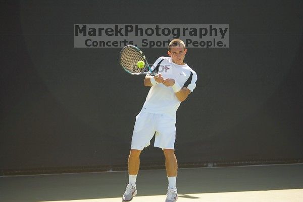 Texas' Dimitar Kutrovsky defeated Tech's Jose Muguruza 6-2 and 6-3.  The University of Texas (UT) men's tennis team defeated Georgia Tech (GT) Saturday, February 24, 2007..

Filename: SRM_20070224_1501308.jpg
Aperture: f/2.8
Shutter Speed: 1/2000
Body: Canon EOS-1D Mark II
Lens: Canon EF 80-200mm f/2.8 L