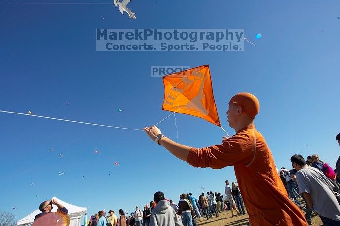 Chris Lam attempts to fly his UT kite at the 79th annual Zilker Park Kite Festival, Sunday, March 4, 2007.

Filename: SRM_20070304_1531508.jpg
Aperture: f/11.0
Shutter Speed: 1/250
Body: Canon EOS-1D Mark II
Lens: Sigma 15-30mm f/3.5-4.5 EX Aspherical DG DF