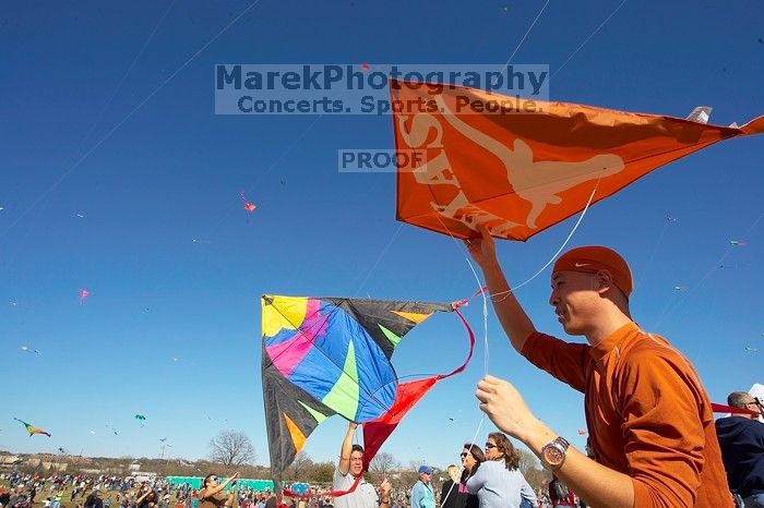 Chris Lam attempts to fly his UT kite at the 79th annual Zilker Park Kite Festival, Sunday, March 4, 2007.

Filename: SRM_20070304_1532080.jpg
Aperture: f/11.0
Shutter Speed: 1/250
Body: Canon EOS-1D Mark II
Lens: Sigma 15-30mm f/3.5-4.5 EX Aspherical DG DF