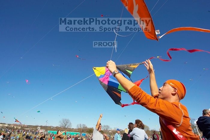 Chris Lam attempts to fly his UT kite at the 79th annual Zilker Park Kite Festival, Sunday, March 4, 2007.

Filename: SRM_20070304_1532102.jpg
Aperture: f/11.0
Shutter Speed: 1/250
Body: Canon EOS-1D Mark II
Lens: Sigma 15-30mm f/3.5-4.5 EX Aspherical DG DF