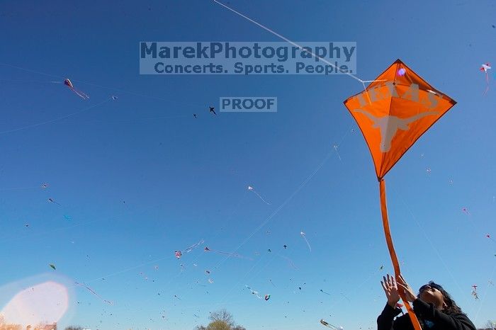 Madhav Tadikonda, class of 1997, and Anjali Patel, class of 1999, fly a UT kite at the 79th annual Zilker Park Kite Festival, Sunday, March 4, 2007.

Filename: SRM_20070304_1537321.jpg
Aperture: f/11.0
Shutter Speed: 1/250
Body: Canon EOS-1D Mark II
Lens: Sigma 15-30mm f/3.5-4.5 EX Aspherical DG DF